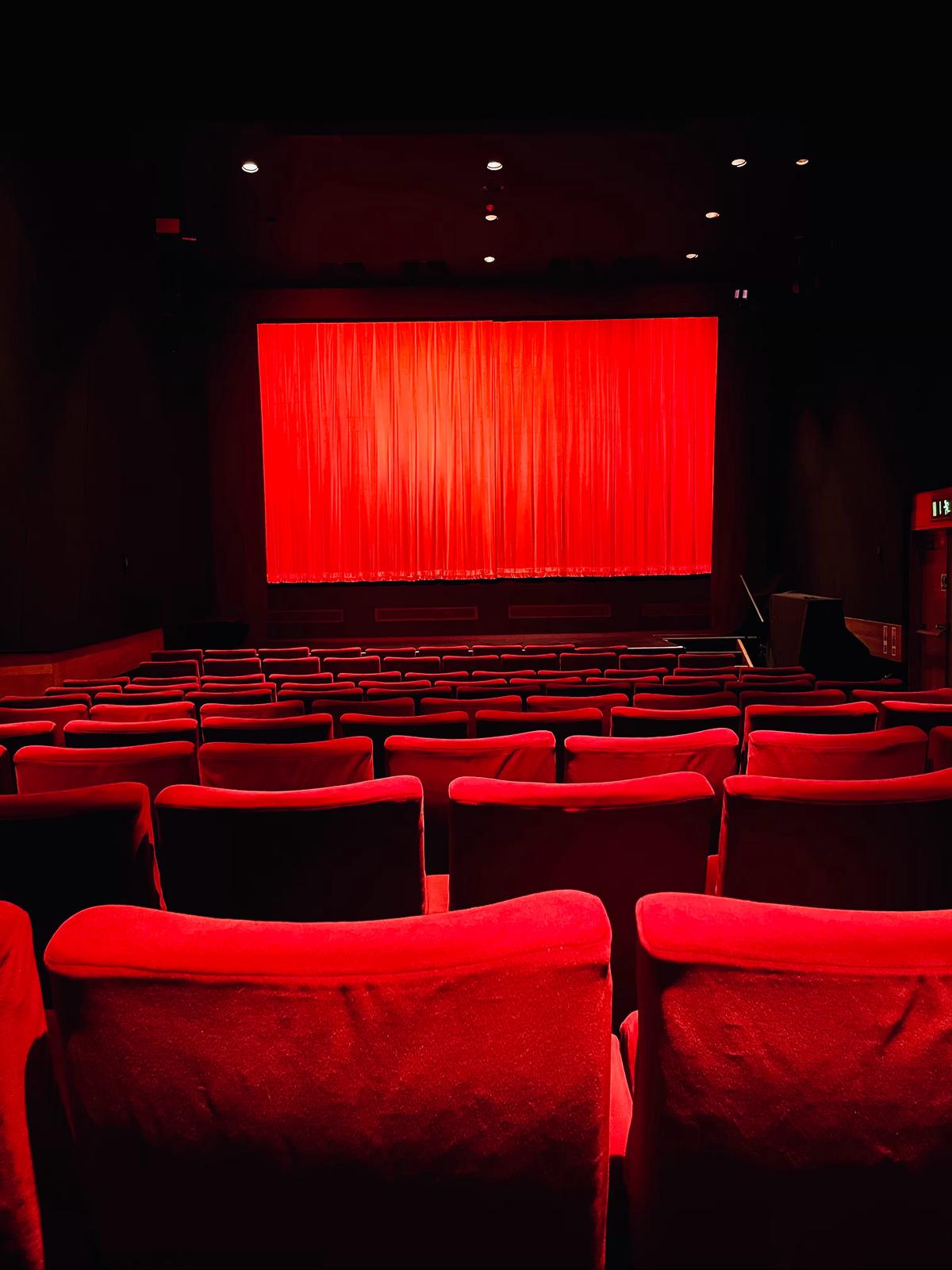 Illustration of Dolby Atmos cinema system with speakers placed all around the room